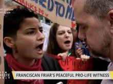 Fr. Fidelis Moscinski, CFR (right) encounters protesters during the July 10 "Witness for Life" prayer procession in Brooklyn.